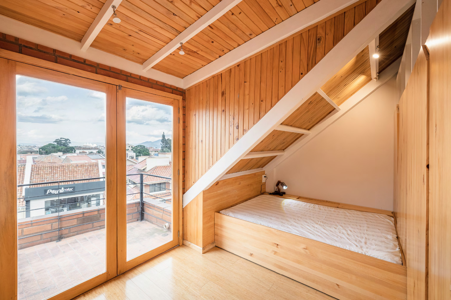 Long elevation highlighting handcrafted façade rhythm